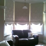 Swagged base roman blinds